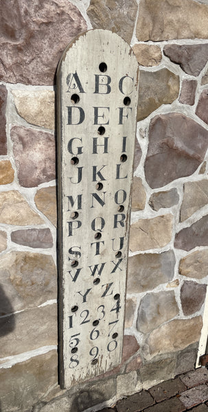 Vertical Alphabet on decorative antique board