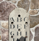 Vertical Alphabet on decorative antique board
