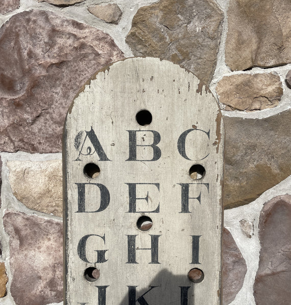 Vertical Alphabet on decorative antique board