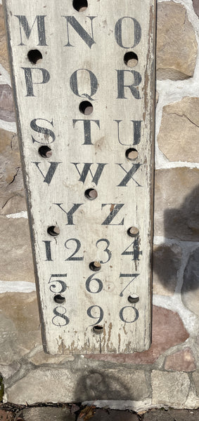 Vertical Alphabet on decorative antique board