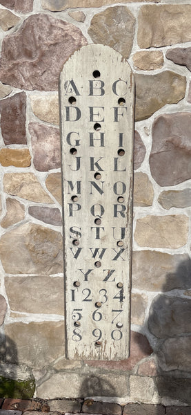 Vertical Alphabet on decorative antique board