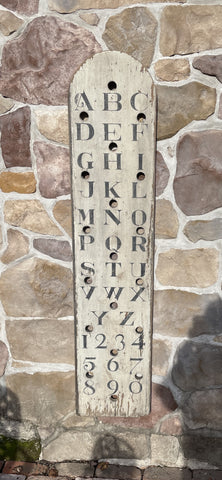 Vertical Alphabet on decorative antique board