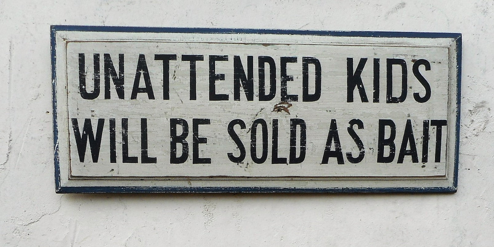 "Unattended Kids" sign
